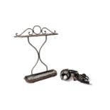 A vintage wrought iron stick stand and a cast iron lantern