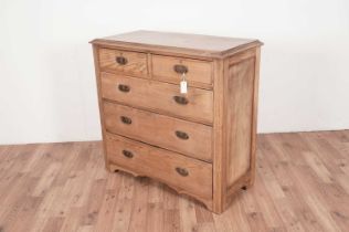 An Edwardian stripped pine chest of drawers