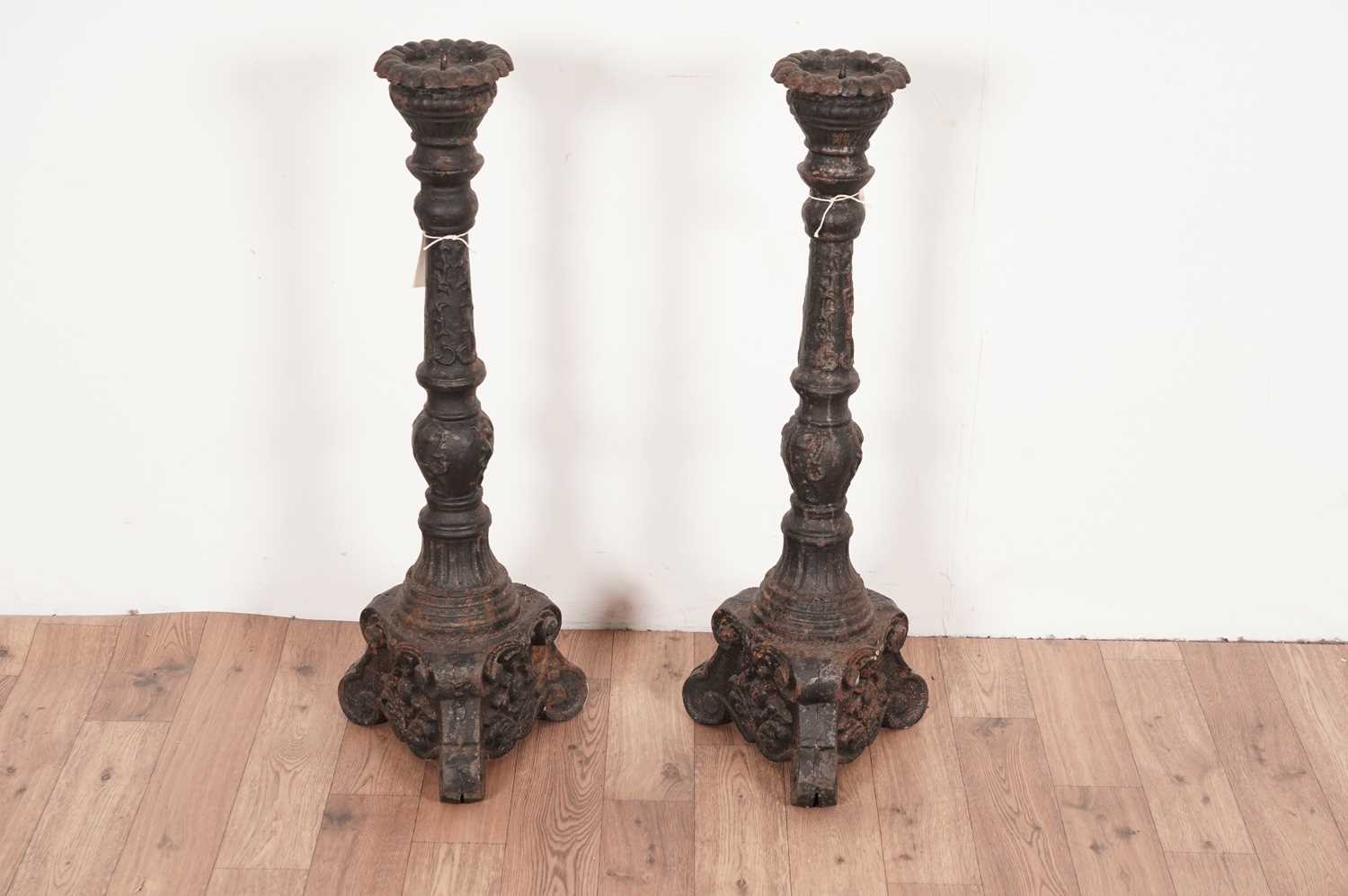 A pair of cast iron candlesticks - Image 2 of 4