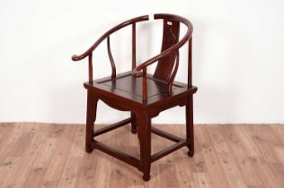 A modern Chinese hardwood horseshoe chair