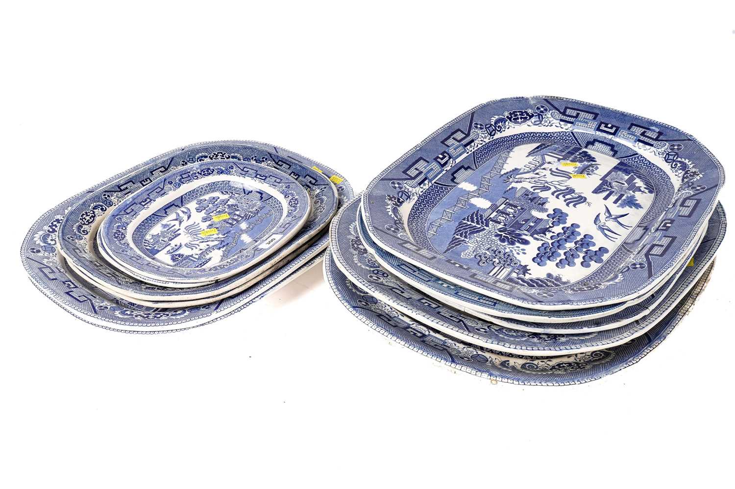 A set of eleven ‘Willow’ pattern graduated meat and serving plates
