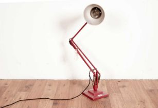 A red metal angle poised lamp