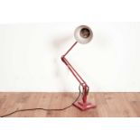 A red metal angle poised lamp