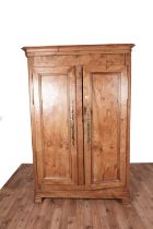 A French early 19th Century style fruitwood armoire