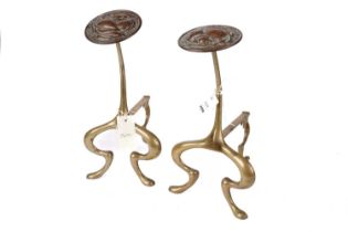 A pair of Arts and Crafts brass fire andirons