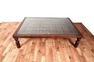 An Asian hardwood coffee table from Barker & Stonehouse