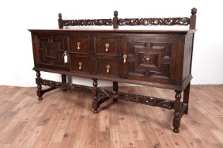 A 1930's Jacobean revival carved oak sideboard