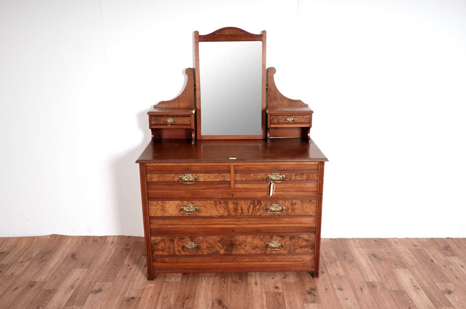 An Edwardian walnut and burr walnut chest of drawers