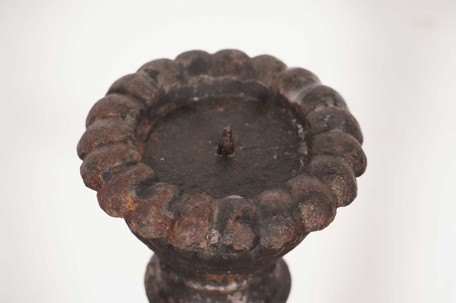 A pair of cast iron candlesticks - Image 3 of 4