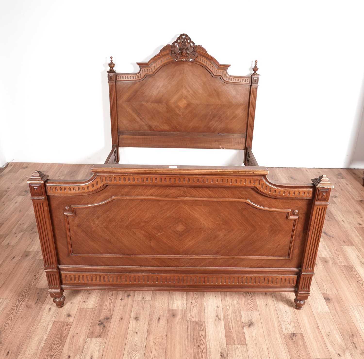 An Louis XVI style walnut bed