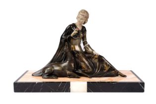 An Art Deco model of a lady kneeling with a deer