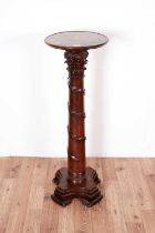 A mahogany jardiniere stand