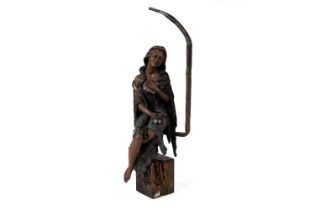 A bronzed cast resin sculpture of a girl sitting