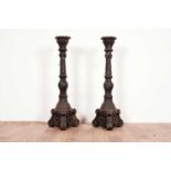 A pair of cast iron candlesticks