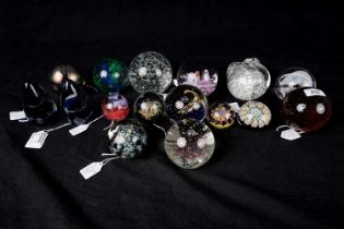 A selection of decorative glass paperweights