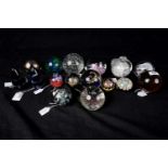 A selection of decorative glass paperweights