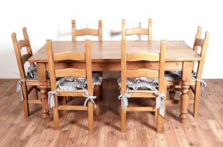 A substantial Victorian style pine kitchen table; and six modern beechwood dining chairs