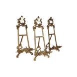 Three Art Nouveau brass tabletop easels
