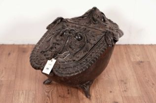 A cast iron coal bin