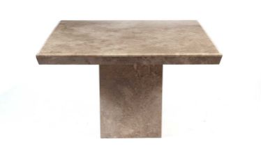 A modern travertine stone table of square form