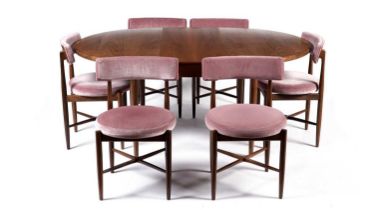 A retro teak extending dining table and chairs