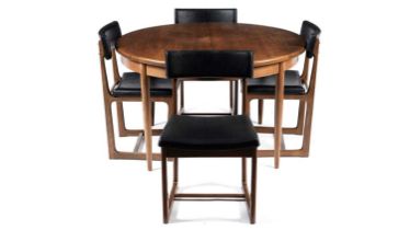 A retro teak extending dining table and four chairs