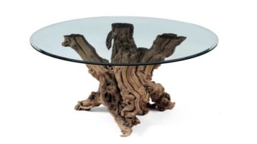 A decorative modern olive wood and glass centre table