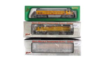 Three boxed Union Pacific model locomotives, by Atlas Masters and Mehano