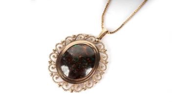 A black boulder opal pendant