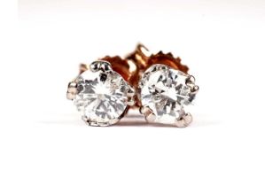 A pair of diamond stud earrings