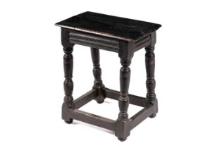 An oak peg jointed stool, 17th/18th Century and later