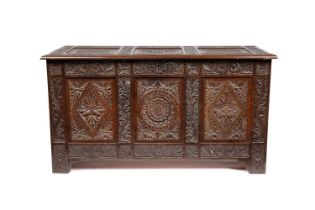 A substantial carved oak three-panel coffer, 19th Century