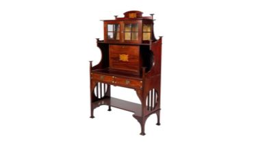 An Arts and Crafts mahogany secretaire cabinet in the Liberty & Co style
