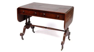 A Regency mahogany and rosewood crossbanded sofa table