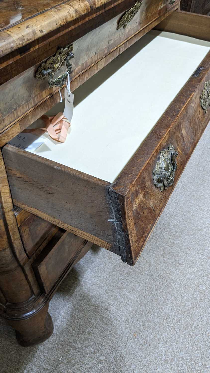 A Dutch burr walnut bombe cabinet on chest, late 18th/early 19th Century - Image 22 of 30