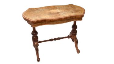 A Victorian carved walnut and burr walnut card table