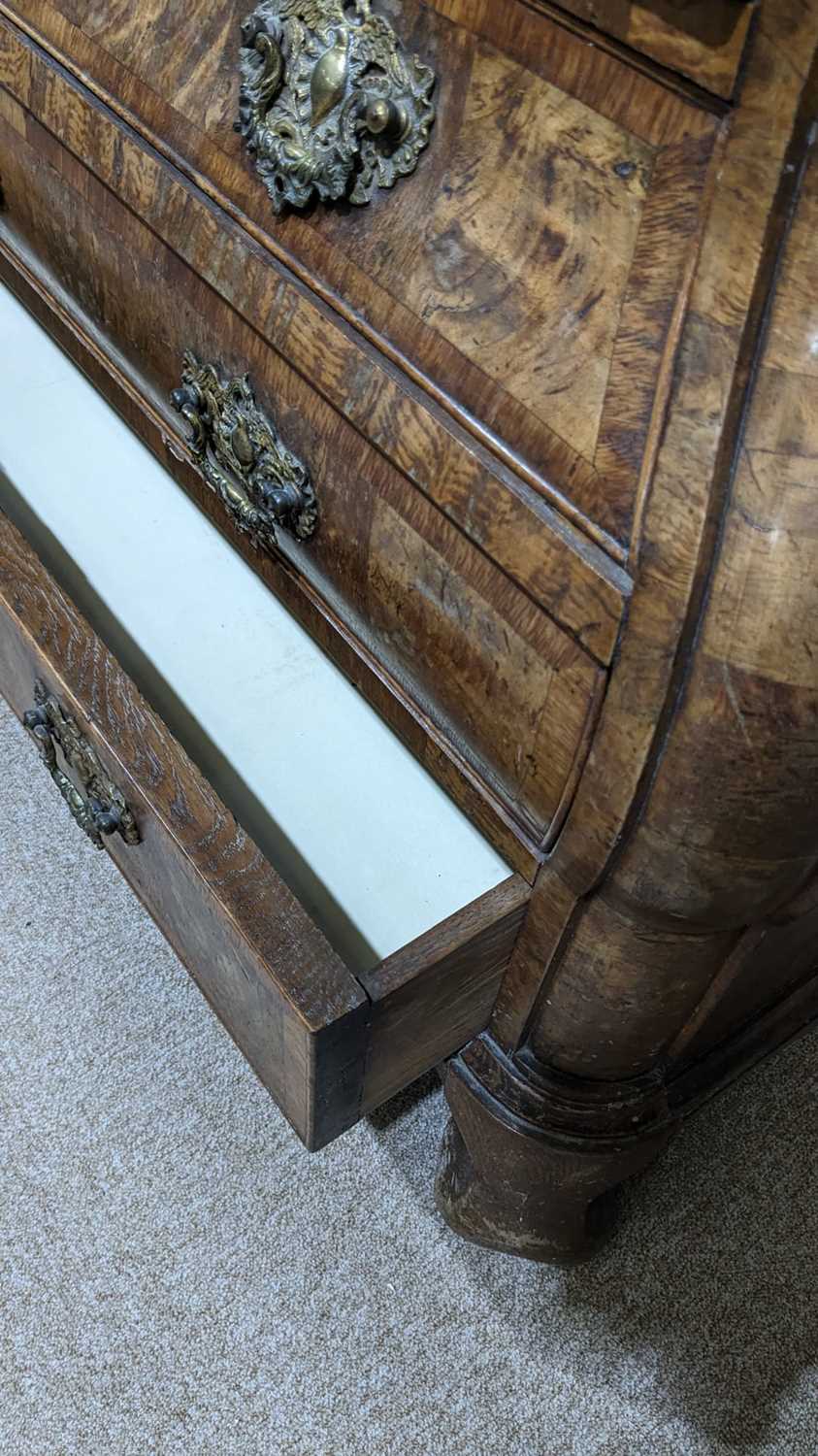 A Dutch burr walnut bombe cabinet on chest, late 18th/early 19th Century - Image 5 of 30