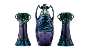 A pair of Minton Secessionist vases, and another