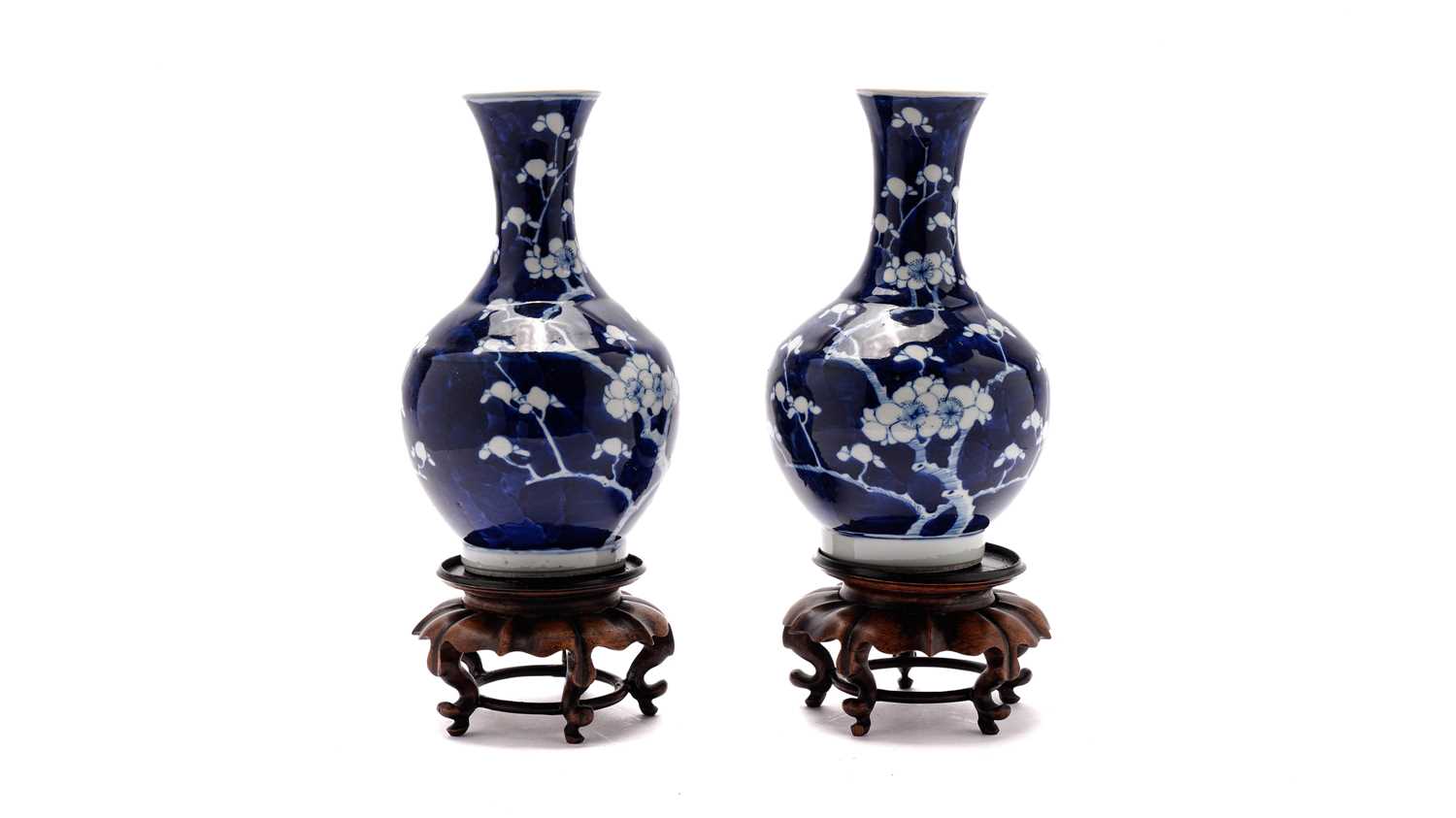 Pair of Chinese prunus blossom vases and stands