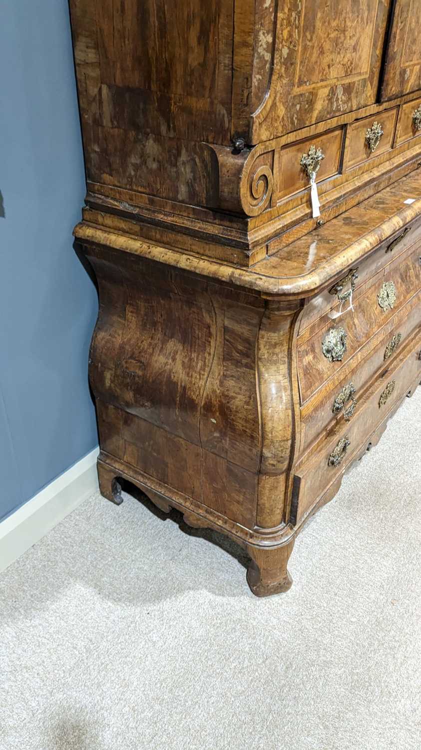 A Dutch burr walnut bombe cabinet on chest, late 18th/early 19th Century - Image 19 of 30