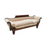 An early Victorian carved mahogany scroll end sofa