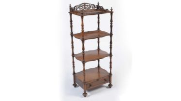 A Victorian rosewood four-tier serpentine whatnot