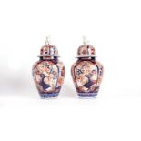 Pair of Japanese Imari vases and covers