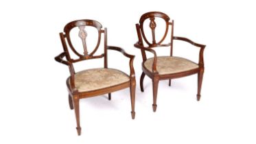 A pair of Edwardian inlaid walnut chairs