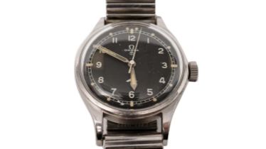 Omega British Military: A stainless steel cased manual wind wristwatch and medals