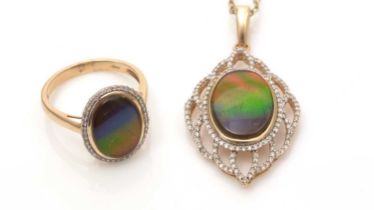 An ammolite and diamond pendant and ring