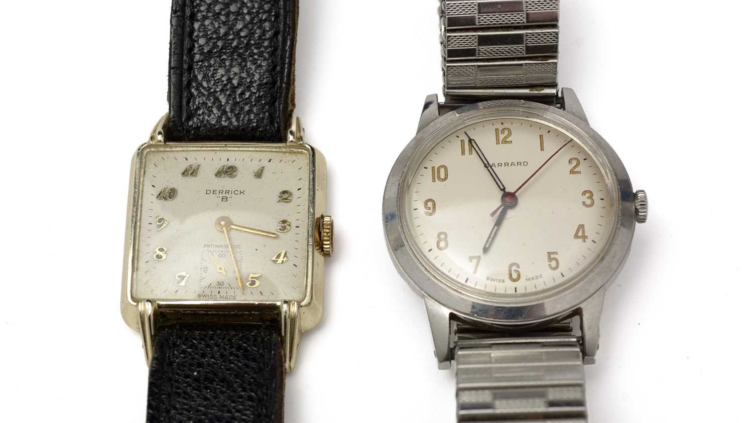 A wristwatch by Garrard and another