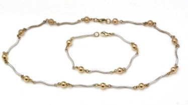 A 9ct yellow and white gold matching bracelet and necklace