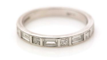 A diamond half hoop eternity ring