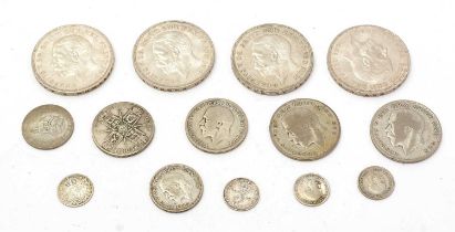 A small collection British coins, including four 1935 'rocking horse' crowns